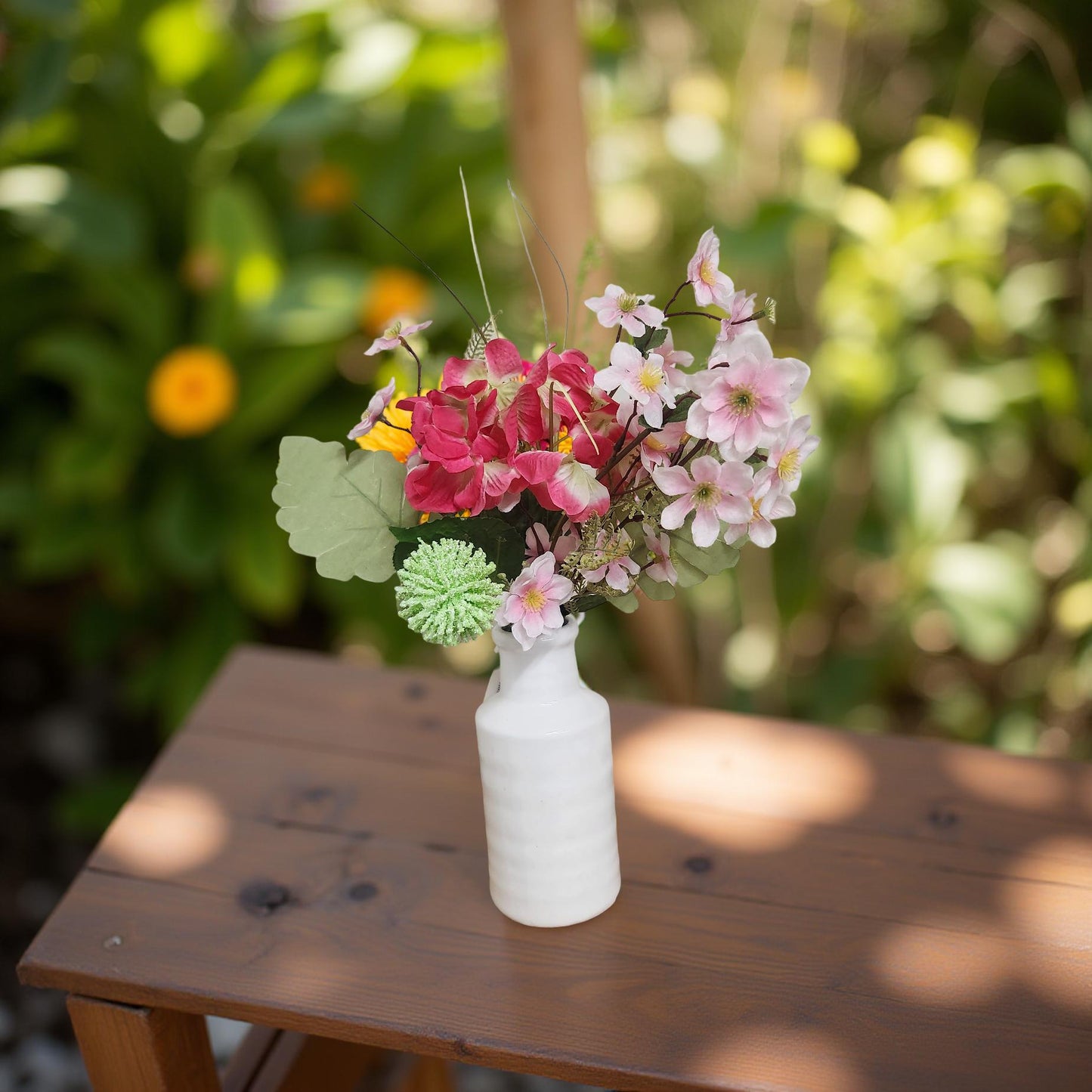 Rustic White Ceramic Vase Adorned with Beautiful Pink Flowers