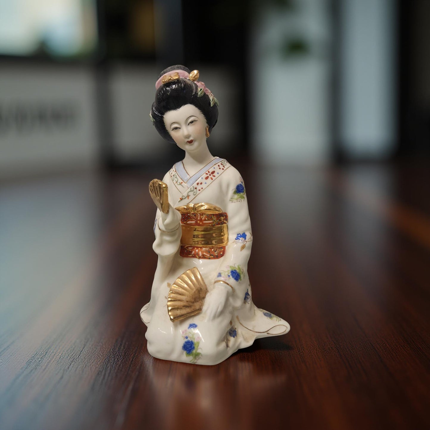 White Porcelain Geisha Figurine with Blue & Gold Floral Design