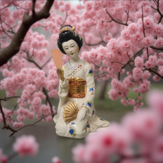 White Porcelain Geisha Figurine with Blue & Gold Floral Design