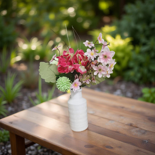 Rustic White Ceramic Vase Adorned with Beautiful Pink Flowers