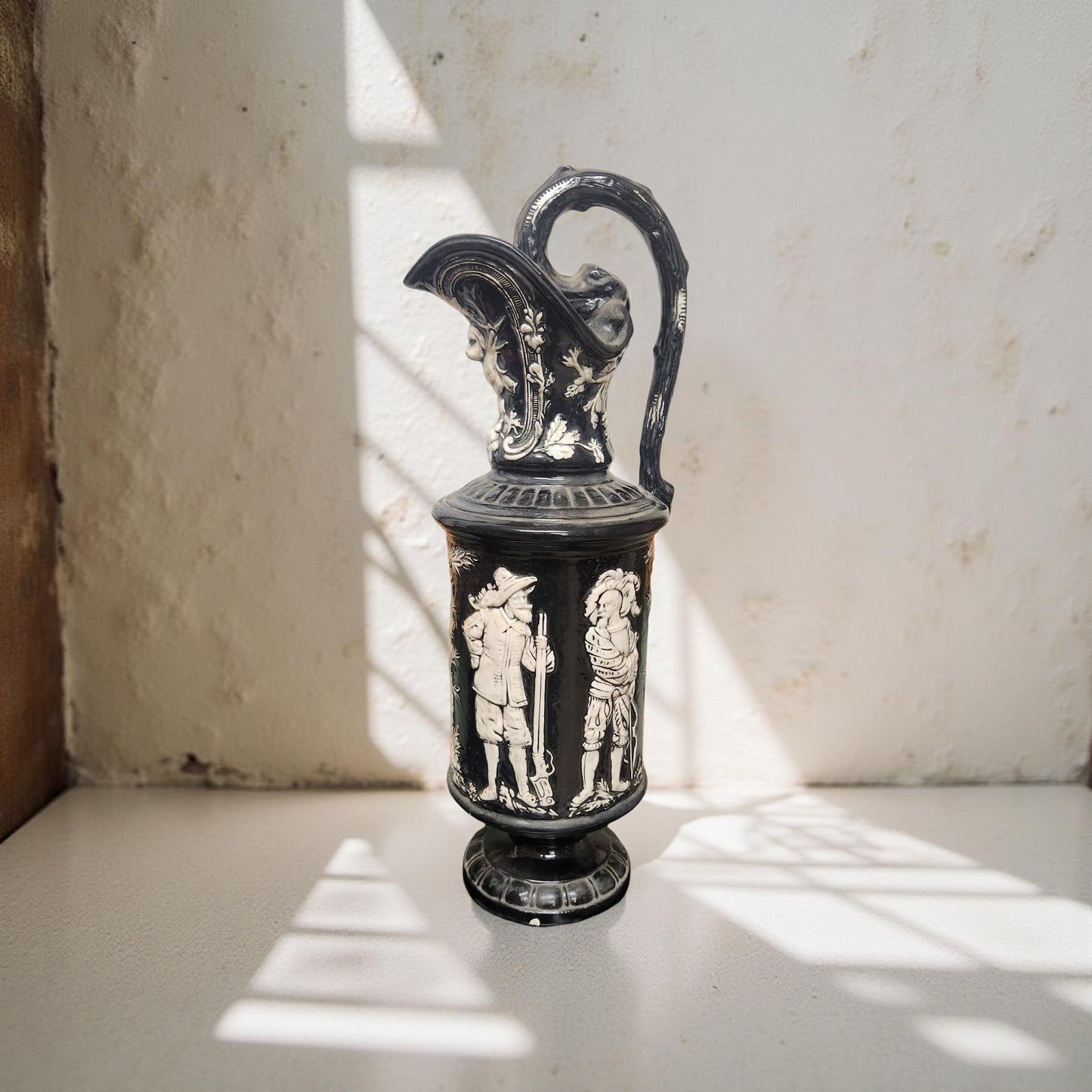 Black and White Antique Pitcher with Soldiers